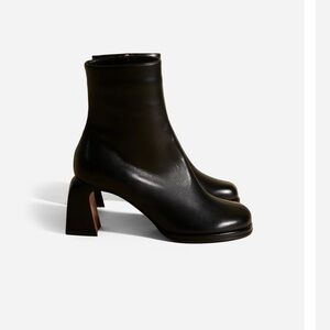 Manu Atelier black leather ankle boots with sculptural heels